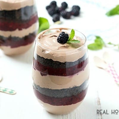 This MIXED BERRY MUDSLIDE PARFAIT is layered with boozy mudslide mousse, crumbly cookies, and a sweet & tart berry puree for a flavorful dessert that's incredibly rich!