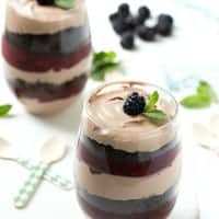 This MIXED BERRY MUDSLIDE PARFAIT is layered with boozy mudslide mousse, crumbly cookies, and a sweet & tart berry puree for a flavorful dessert that's incredibly rich!