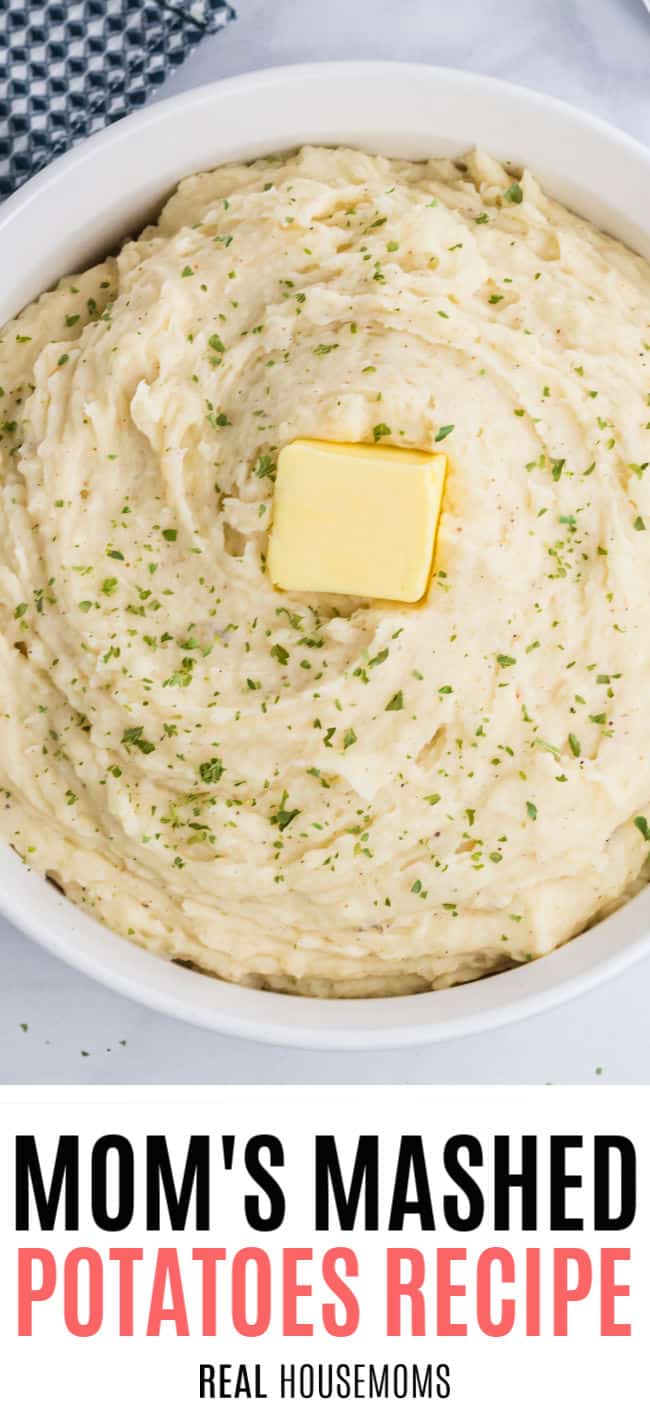 close of a serving bowl of mashed potatoes with butter