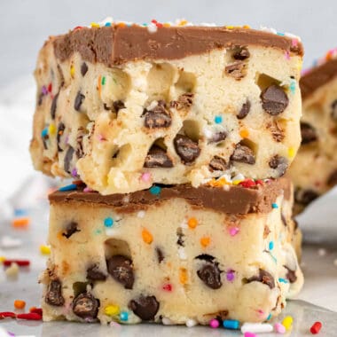square image of two no bake cookie dough bars stacked on each other