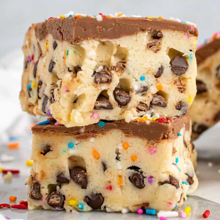square image of two no bake cookie dough bars stacked on each other