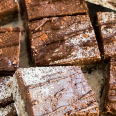 These delicious NO BAKE PEANUT BUTTER COOKIE DOUGH BARS are the ultimate treat! They're made with an egg-free (and dairy-free!) cookie dough base and a chocolate peanut butter topping. They're a naturally vegan dessert and totally addictive!