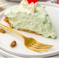 slice of no bake pistachio pie on a plate with recipe name at the bottom