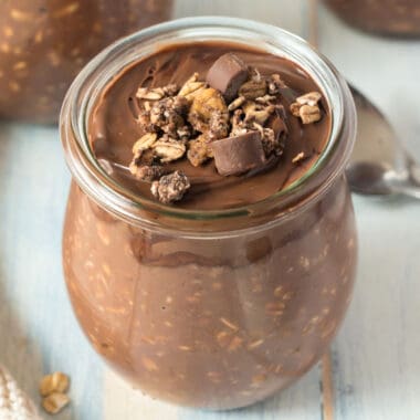 square image of nutella overnight oats topped with nutella and granola