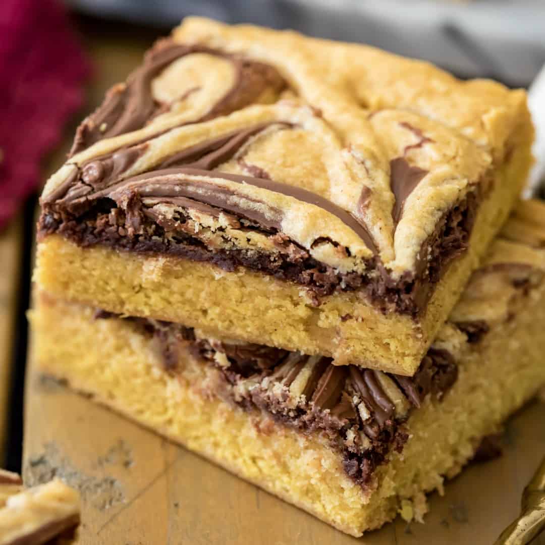 Nutella Swirled Pumpkin Bars are a perfect Fall treat! They're soft and chewy with irresistible pumpkin spice flavors and a ribbon of Nutella!