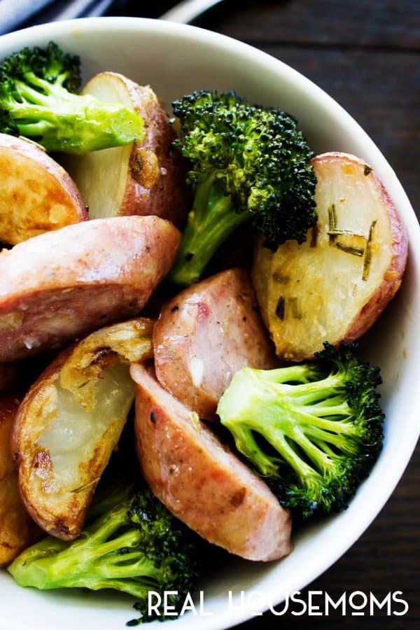 One Pan Rosemary Garlic Broccoli, Potatoes & Sausage is an easy sheet pan dinner that will feed the whole family in less than an hour!