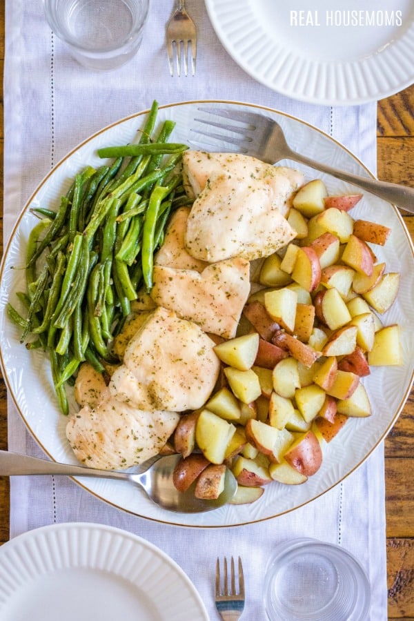 serving platter with rach chicken, roasted potatoes and green beans