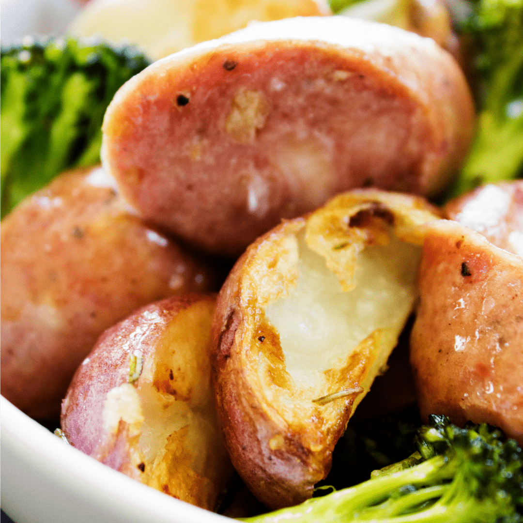 One Pan Rosemary Garlic Broccoli, Potatoes & Sausage is an easy sheet pan dinner that will feed the whole family in less than an hour!