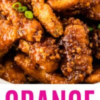 close up of copycat orange chicken with sliced green onion wither recipe name at bottom