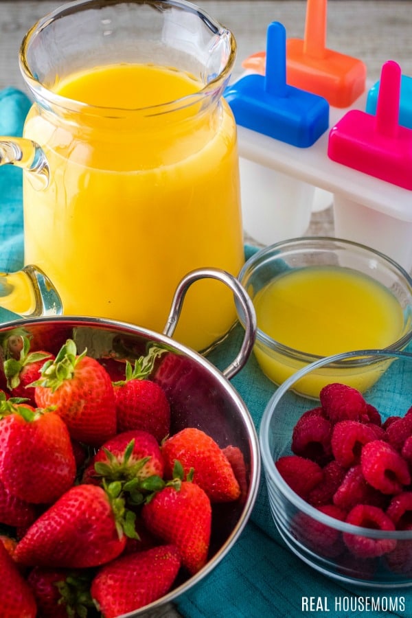 ingredients to make orange juice ice pops