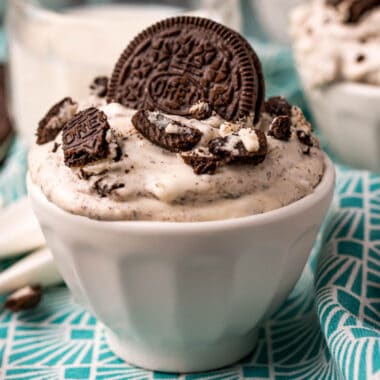 square image of oreo fluff in a bowl topped with more oreos