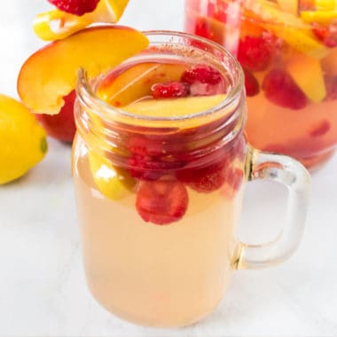 The perfect blend of sweet peaches, tart lemonade, and delicious alcohol. Peach Lemonade Sangria is sure to be your go-to drink as you relax this summer!