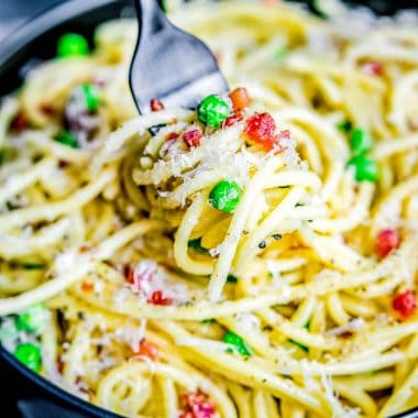 Pasta Carbonara is a creamy, cheesy pasta tossed with crisp prosciutto and bright English peas. It's a classic Italian recipe made with simple, quality ingredients!