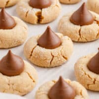 peanut butter blossoms arrange don a cookie sheet with recipe name at the bottom