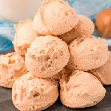 square image of peanut butter cheesecake fat bombs piled on a plate