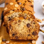 square image of slices of peanut butter chocolate chip banana bread leaning against the loaf