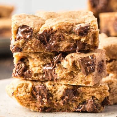 square image of 3 peanut butter chocolate chip bars stacked up