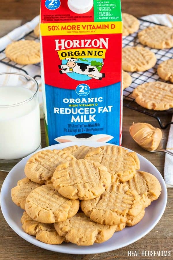 a plate of peanut butter cookies with a glass of Horizon Organic milk