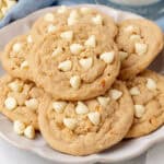 square image of peanut butter & white chocolate chip cookies piled on a plate