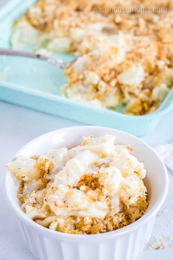 pearl onion & cheese gratin served in a small casserole dish