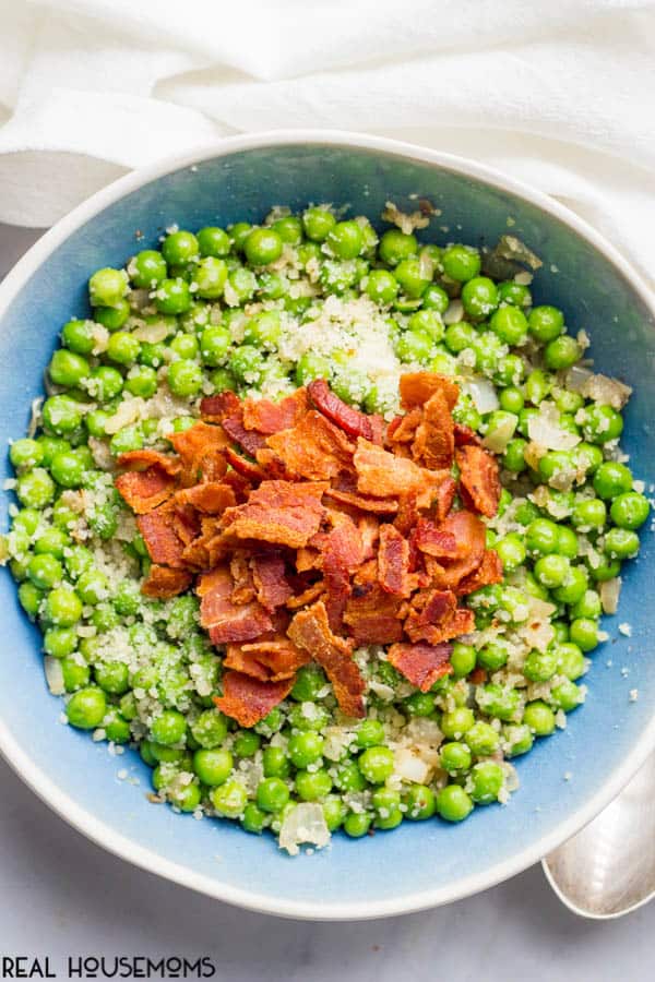 Peas with bacon, shallots and Parmesan cheese is a quick, easy and super flavorful way to dress up a bag of frozen peas!
