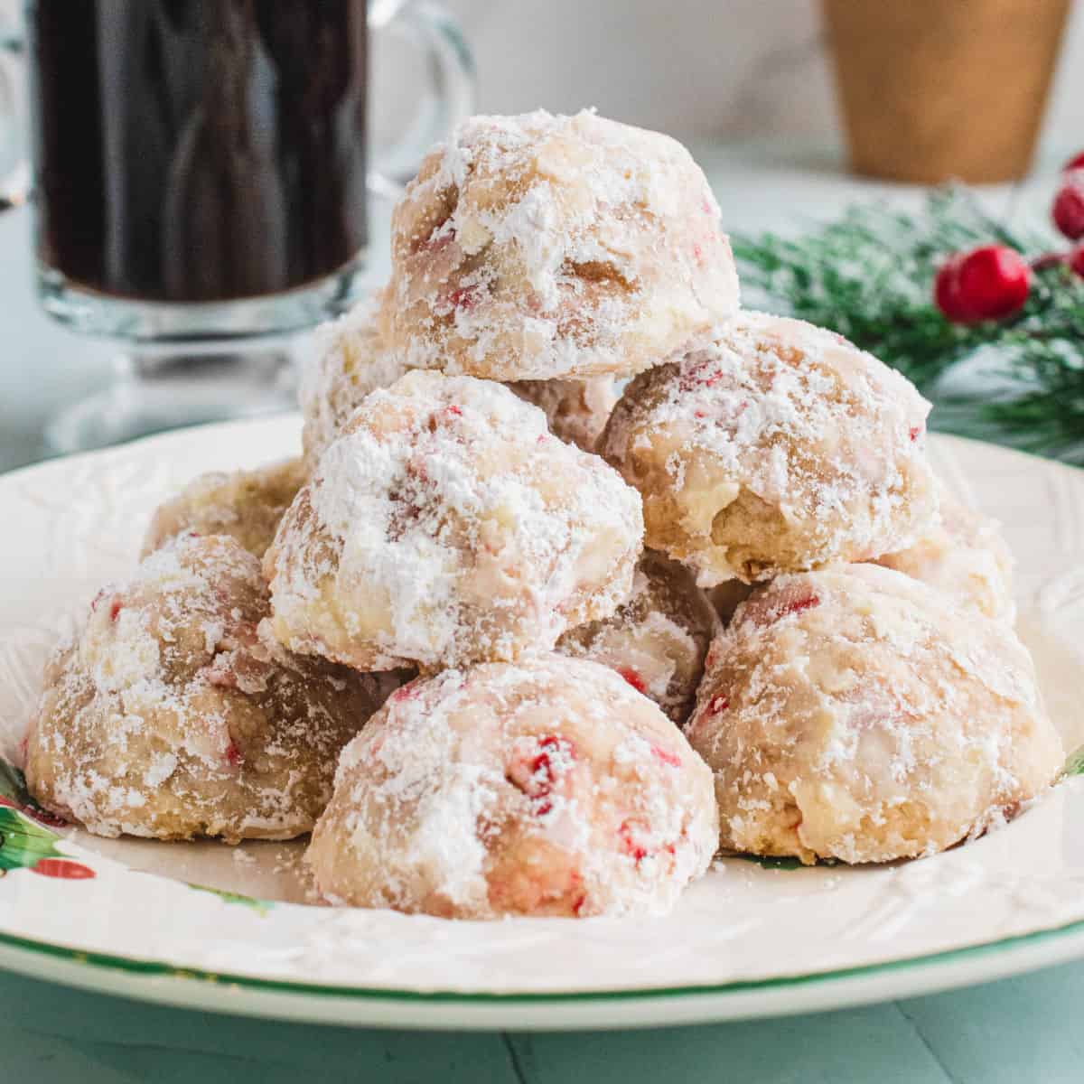 square image of peppermint shortbread cookies piled on a plate