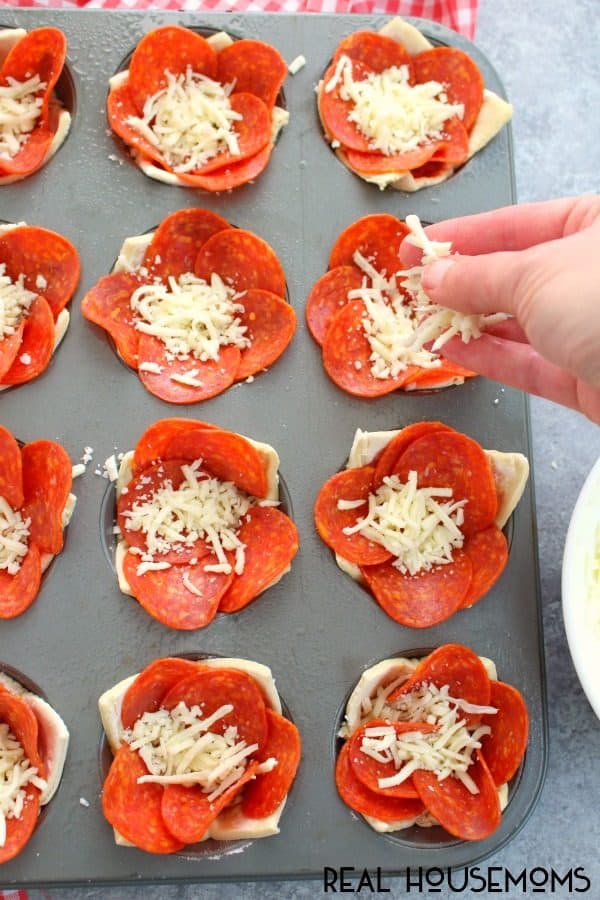 Pepperoni Pizza Puffs filled with pizza sauce, mozzarella cheese, pepperoni, and more cheese!