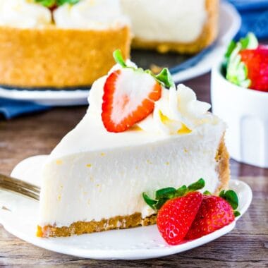Perfectly Easy No-Bake Cheesecake is creamy with a silky smooth texture and crunchy graham cracker crust. Learn all the tricks for the perfect cheesecake!