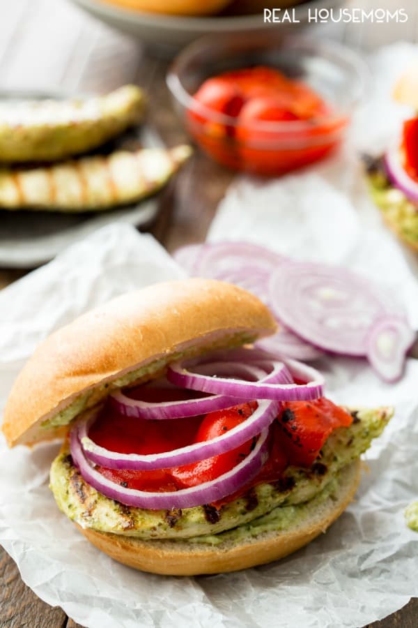 This Grilled Pesto Chicken Sandwich is delicious topped with a pesto mayonnaise, roasted bell pepper, and purple onion!