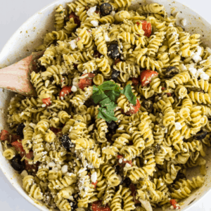 Pesto Pasta Salad is light, fresh, and chocked-full of amazing flavor. It’s so simple to make that it’s a MUST-HAVE for any potluck or picnic!