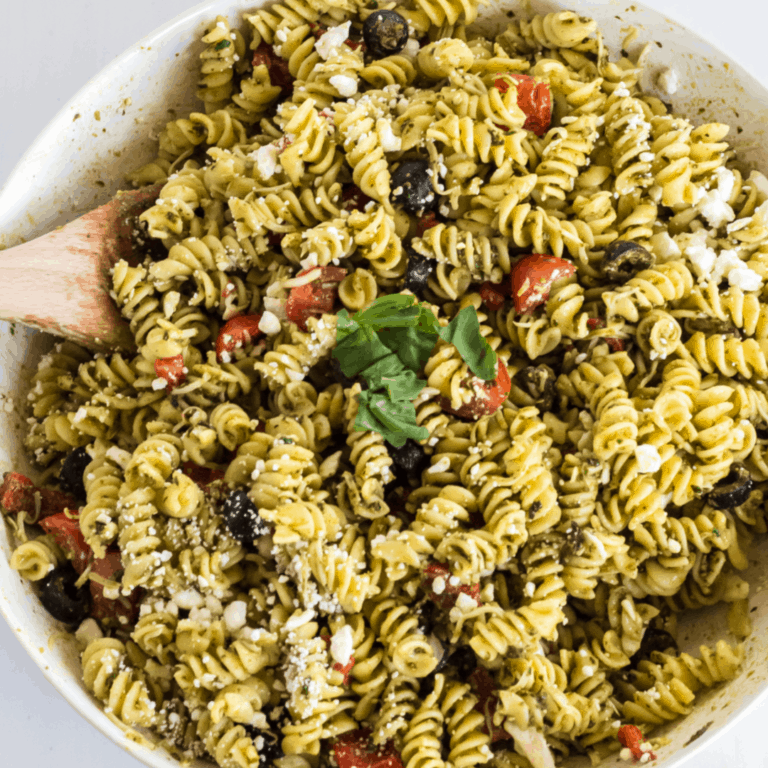 Pesto Pasta Salad is light, fresh, and chocked-full of amazing flavor. It’s so simple to make that it’s a MUST-HAVE for any potluck or picnic!