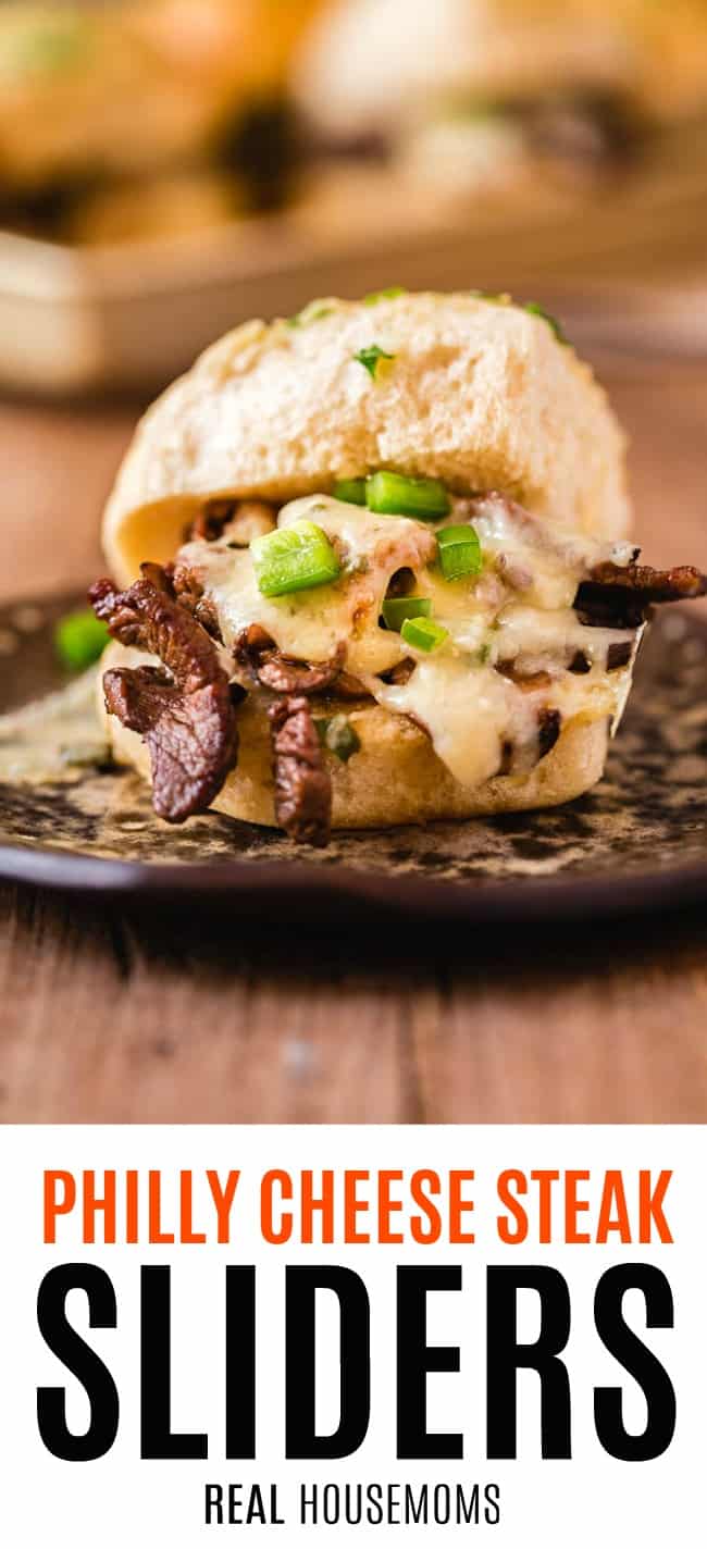 philly cheese steak slider on a plate with melty cheese, steak, and bell pepper