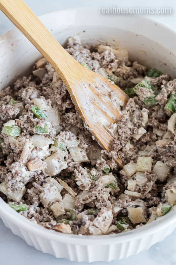 ground beef, vegetables, cream cheese, and Worcestershire mixed in a bowl