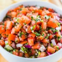 Pico De Gallo is my favorite way to add fresh tangy flavor to Latin-inspired meals. It comes together quickly, easily and you likely already have most of the ingredients needed in your kitchen!