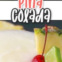 Frozen coconut cocktail with cherry and pineapple garnish