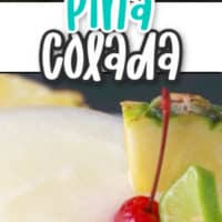 pina colada with cherry and pineapple garnish