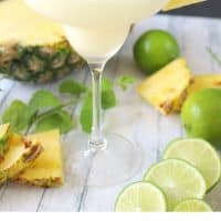 pina colada served in a pmargarita glass with pineapple wedge and cherry