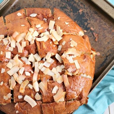 If you are looking for a sweet tropical treat that will feed a crowd, you can't go wrong with this easy to make PIÑA COLADA PULL-APART BREAD!