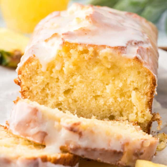 square image of pineapple bread with slices cut to show the inside of the loaf
