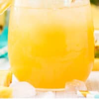 close up of pineapple lemonade with recipe name at bottom