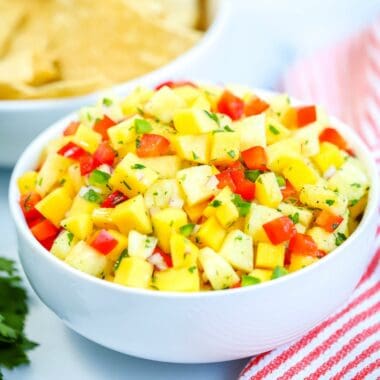 Easy, fresh and flavorful Pineapple Mango Salsa! Serve with tortilla chips or with grilled chicken, fish, tacos, and more!