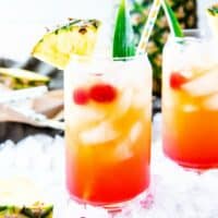 Throw your cares away while you enjoy this Pineapple Rum Punch! A pitcher of this fruity Caribbean cocktail will make you feel like you're on vacation!