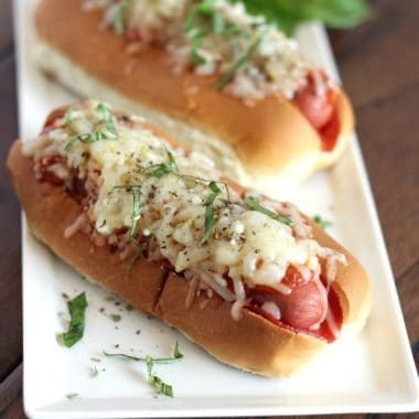 PIZZA HOT DOGS take on a fun flavor featuring pepperoni, sauce, and gooey cheese for the ultimate kid-pleasing meal!