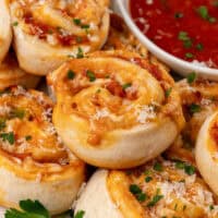 square image of pizza pinwheels on a plate