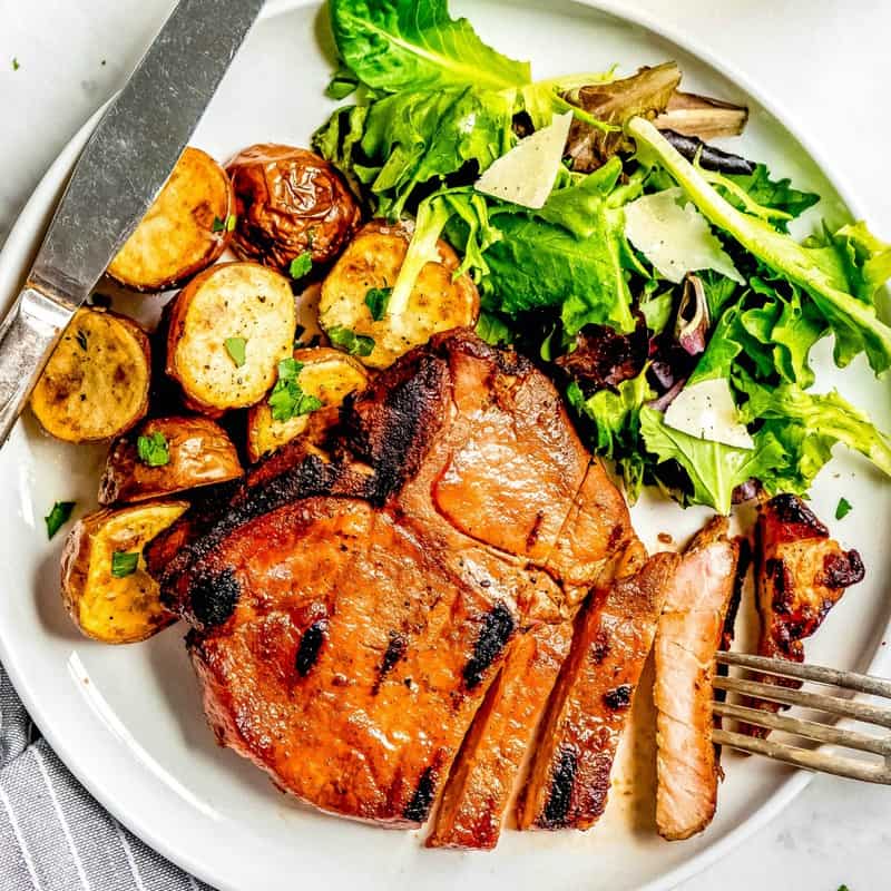 This Pork Chop Marinade is the best! With a just a few ingredients you'll be sitting down to the most flavorful juicy pork chops around!