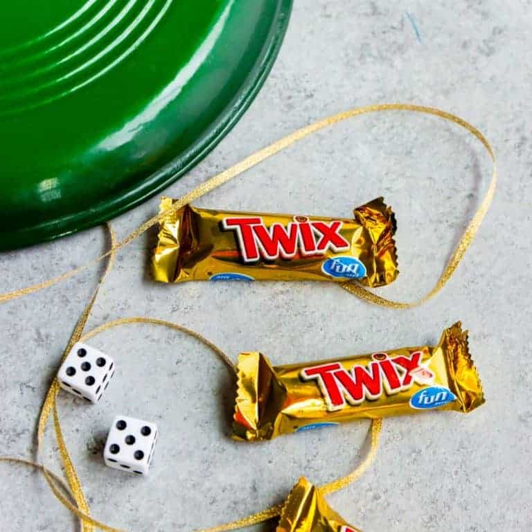 This Pot of Gold St. Patrick's Day game is simple to play & great for large groups of all ages. All you need is a pair of dice, some string, gold candy & a pot!