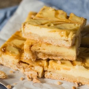 Praline Cheesecake Bars with a shortbread crust. You'll love the toffee bits and caramel swirls baked inside!