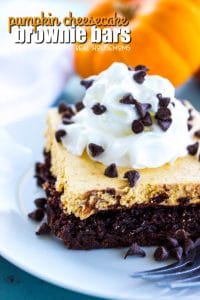 Pumpkin Cheesecake Brownie Bars are topped with a pumpkin no-bake cheesecake then finished off with whipped topping and mini chocolate chips. This is an easy fall must-have!