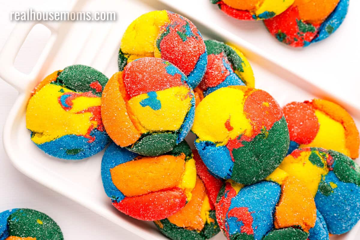 looking down at rainbow cake mix cookies on a white platter