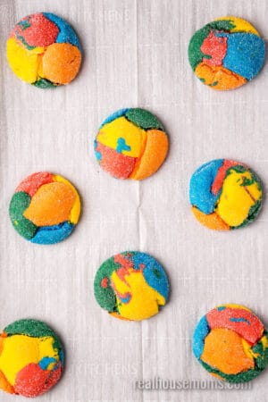 baked rainbow cake mix cookies on a baking sheet